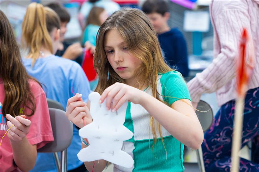 Fifth graders at Pearre Creek learn how to sew